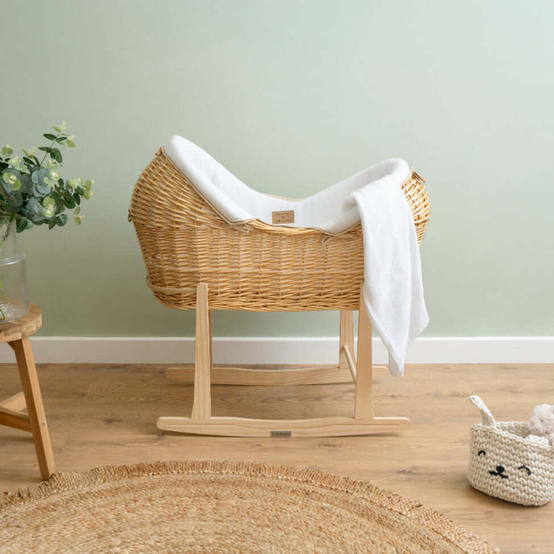 The Organic Cellular Blanket draped over the Organic Noah Pod in a sage green nursery | Baby Essentials | Buying Guide - Clair de Lune UK