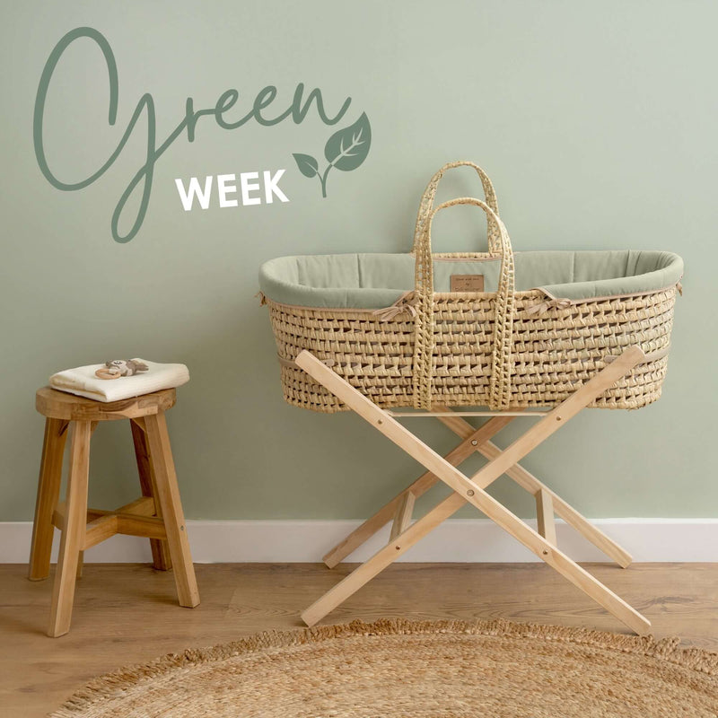 Organic Palm Moses Basket with natural pine folding stand in a neutral green nursery | Co-Sleepers - Clair de Lune UK