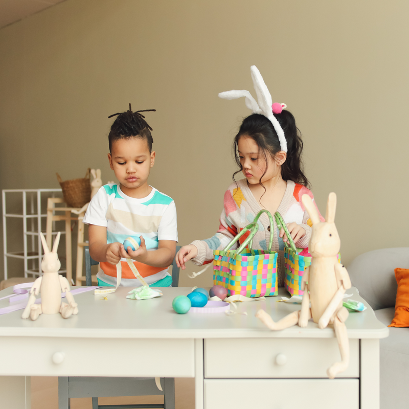 Brother and sister wearing bunny ears making easter egg decorations | Easter | Family Time - Clair de Lune UK