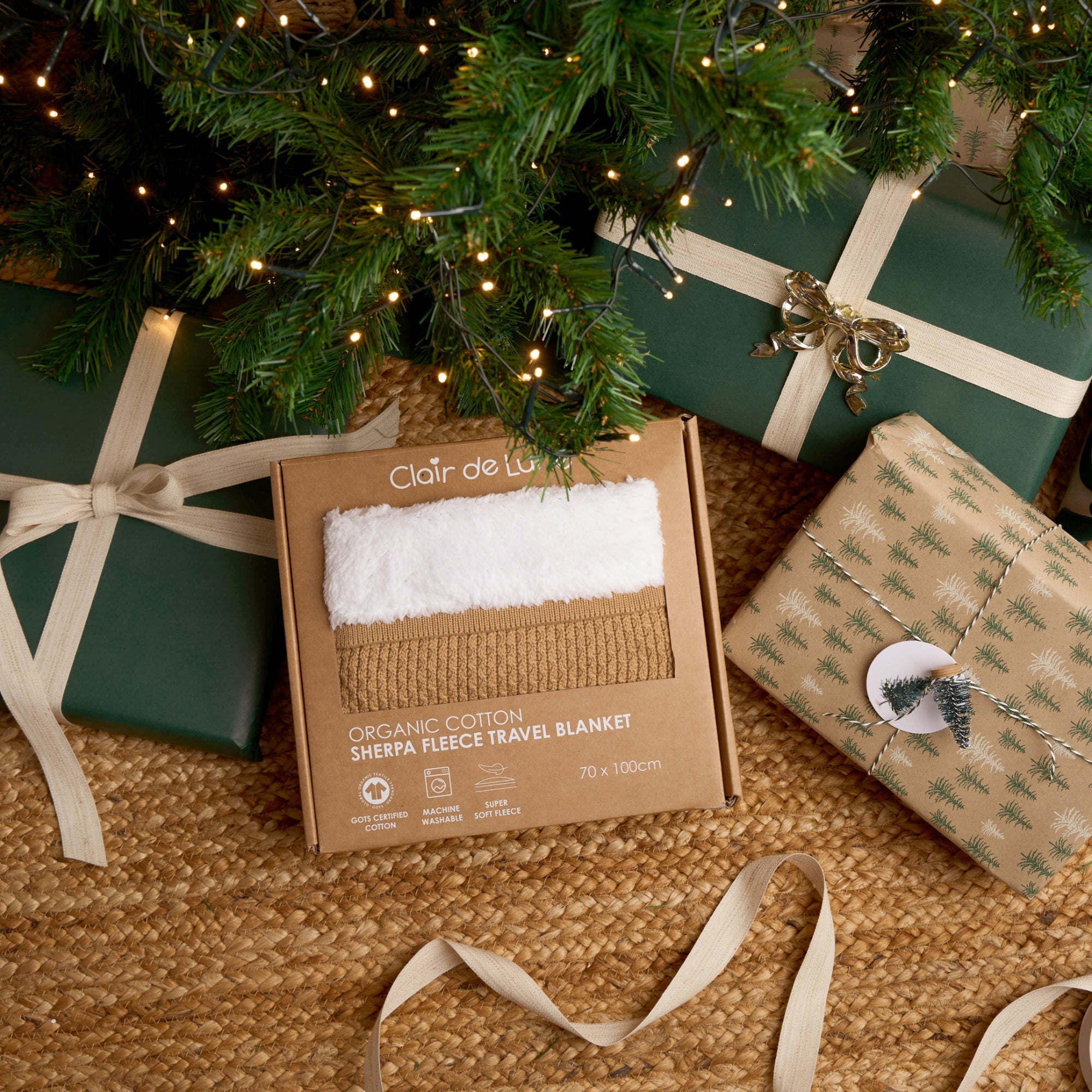 Top Tips for Black Friday Shopping 2025 | Organic Sherpa Blanket unwrapped by the Christmas tree - Clair de Lune UK