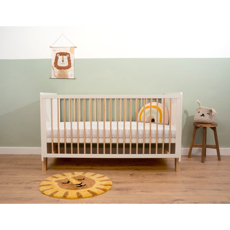 White Essentials Cot Bed in a sage green and white nursery with safari lion baby accessories | Nursery Furniture - Clair de Lune UK
