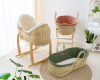 Rust Organic Moses Basket, Forest Green Organic Palm Moses basket and cream natural Noah Pod on rocking stands in neutral nursery | Bassinets | Nursery Furniture - Clair de Lune UK