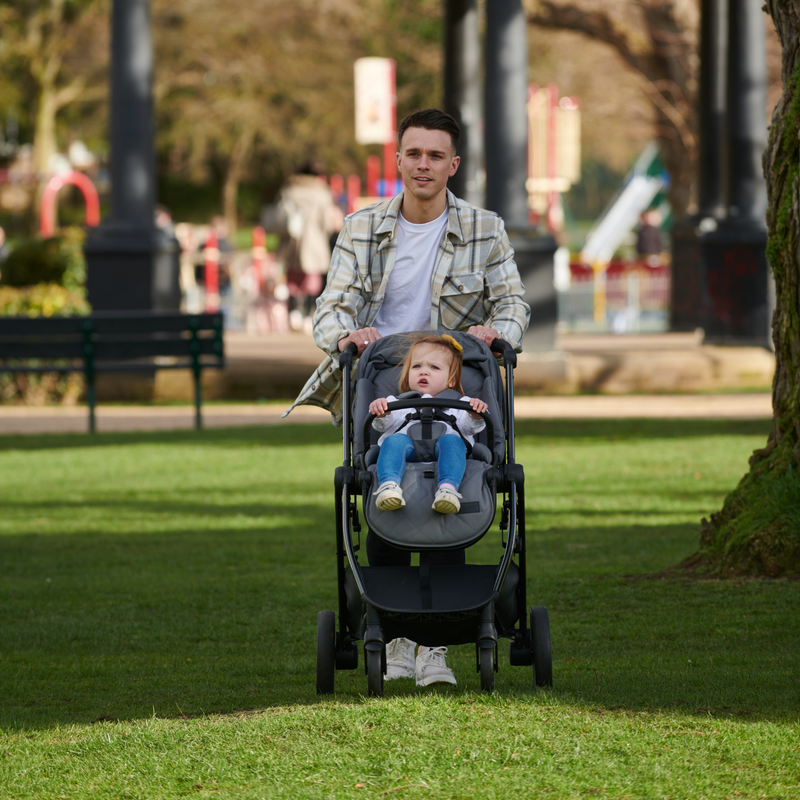 Dad pushing daughter in the Didofy Stargazer Lightweight Pushchair in the park | Pushchairs - Clair de Lune UK