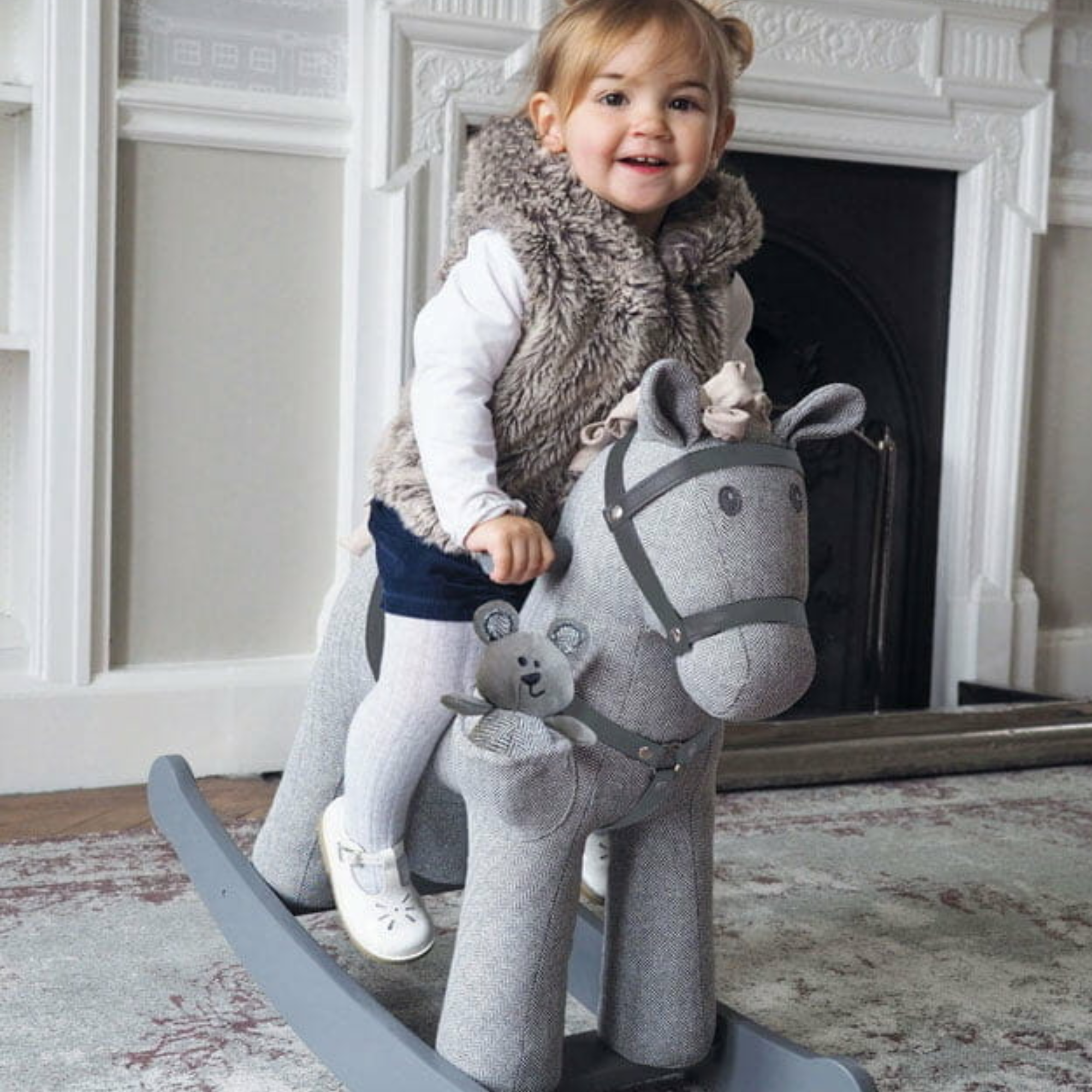 Child riding a grey Little Bird Told Me rocking horse | Kids Toys - Clair de Lune UK