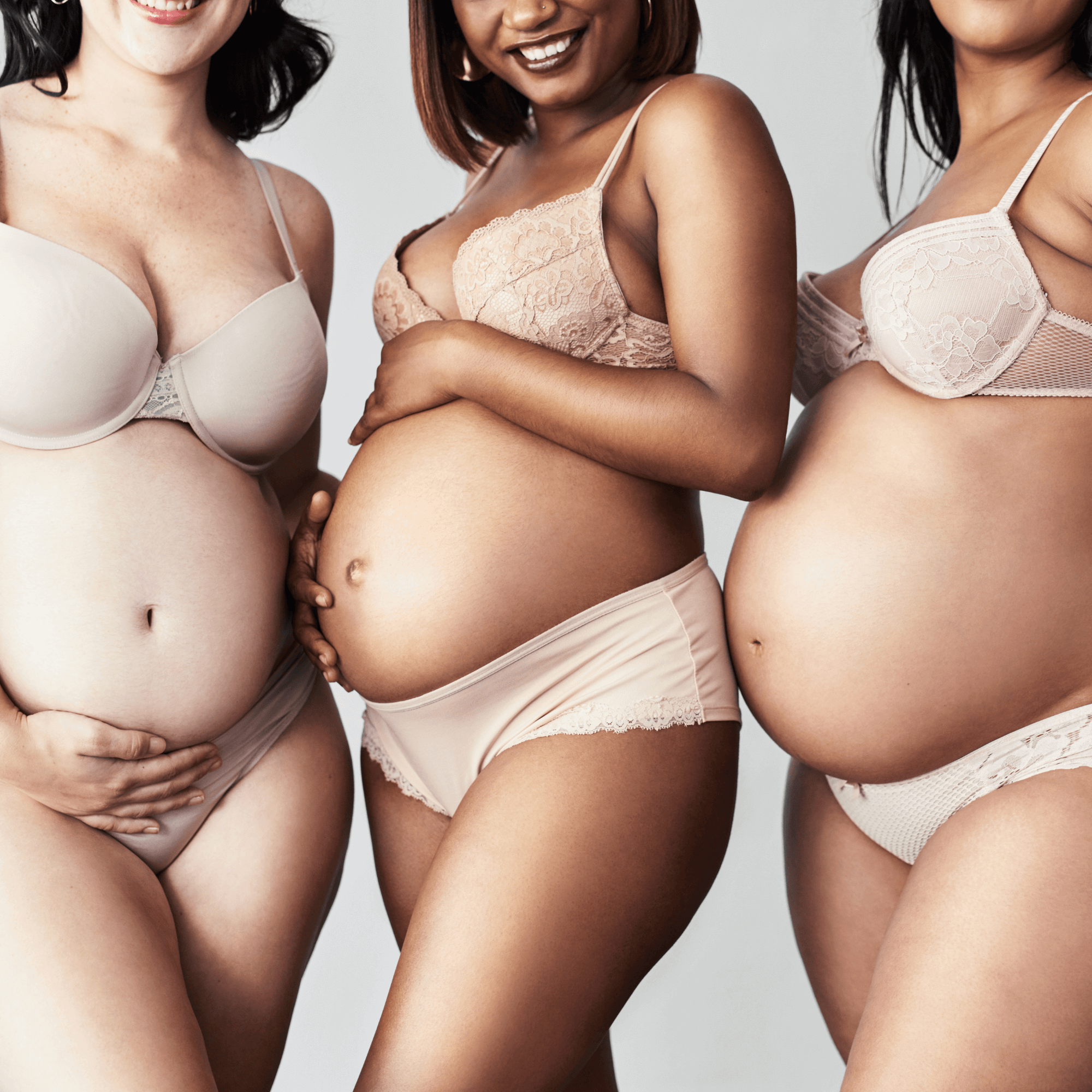 3 pregnant women in their underwear holding their baby bumps | Body positivity - Clair de Lune UK