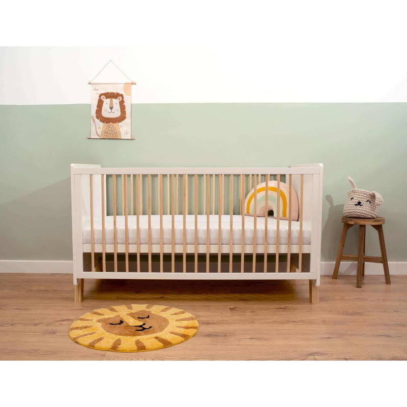 The Essentials Cot Bed in a sage green and white nursery with safari lion baby accessories | Nursery Furniture - Clair de Lune UK