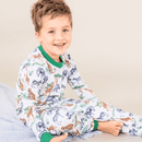 Boy sat comfortlably wearing the Grow Grows Organic Safari Slumber Pyjamas | Organic Kids PJs and Nightwear - Clair de Lune UK