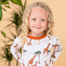 Child wearing the Grow Grows Organic Gentle Giraffes Pyjamas | Organic Kids PJs and Nightwear - Clair de Lune UK