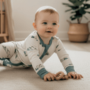 Baby crawling on the floor of the nursery wearing the Grow Grows Organic Little Summit Sleepsuit | Baby Grows and Onesies | Organic Baby Clothes - Clair de Lune UK