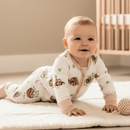 Baby crawling on the floor Grow Grows Organic Sleepy Sloth Sleepsuit on white background | Baby Grows and Onesies | Organic Baby Clothes - Clair de Lune UK