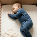 Baby wearing the navy Grow Grows Organic Ribbed Baby Sleepsuit | Baby Sleep Wear | Children's pyjamas - Clair de Lune UK
