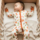 Baby asleep in the crib wearing the GrowGrows Autumnal Amazes Sleepsuit | Baby Grows and Onesies | Organic Baby Clothes - Clair de Lune UK