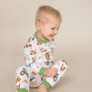 Toddler sat wearing the Grow Grows Organic Family Farm Pyjamas | Organic Kids PJs and Nightwear - Clair de Lune UK