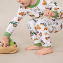 Toddler bending down to play with toys wearing the Grow Grows Organic Family Farm Pyjamas | Organic Kids PJs and Nightwear - Clair de Lune UK