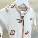 Close up of the GrowGrows Happy Hedgehogs Organic Sleepsuit on a hanger | Baby Grows and Onesies | Organic Baby Clothes - Clair de Lune UK