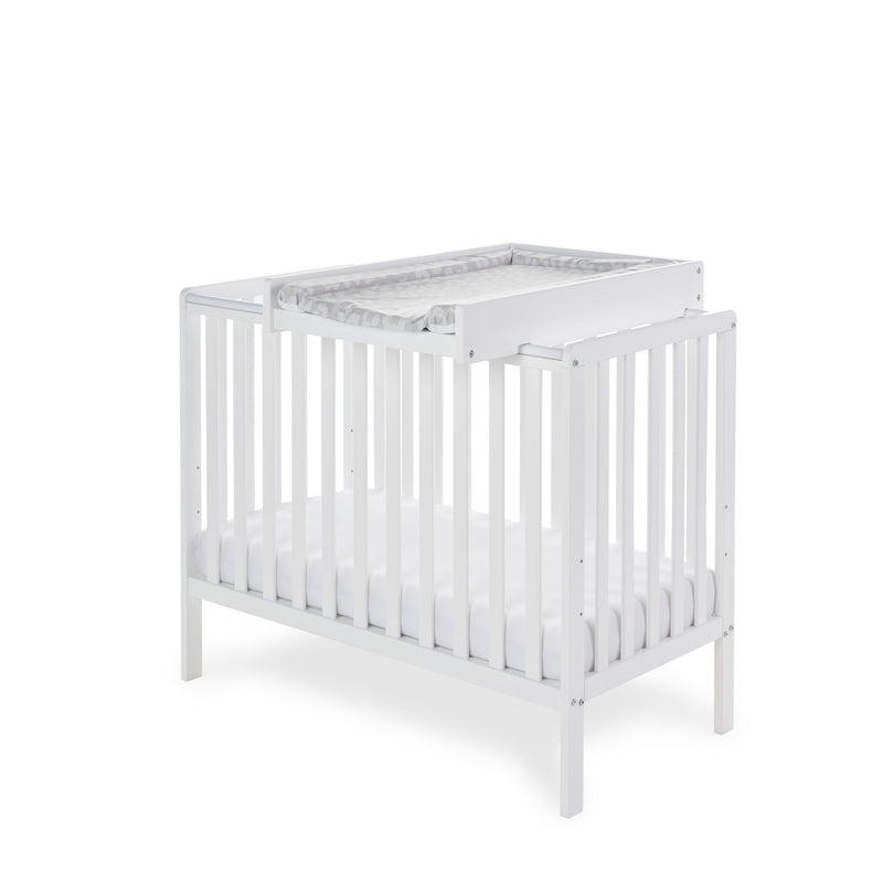 Obaby Space Saver Cot Top Changer with a changing mat on the white Obaby Bantam Space Saver Cot | Baby Changing Units, Tables & Cot Top Changers | Baby Bath Time - Clair de Lune UK