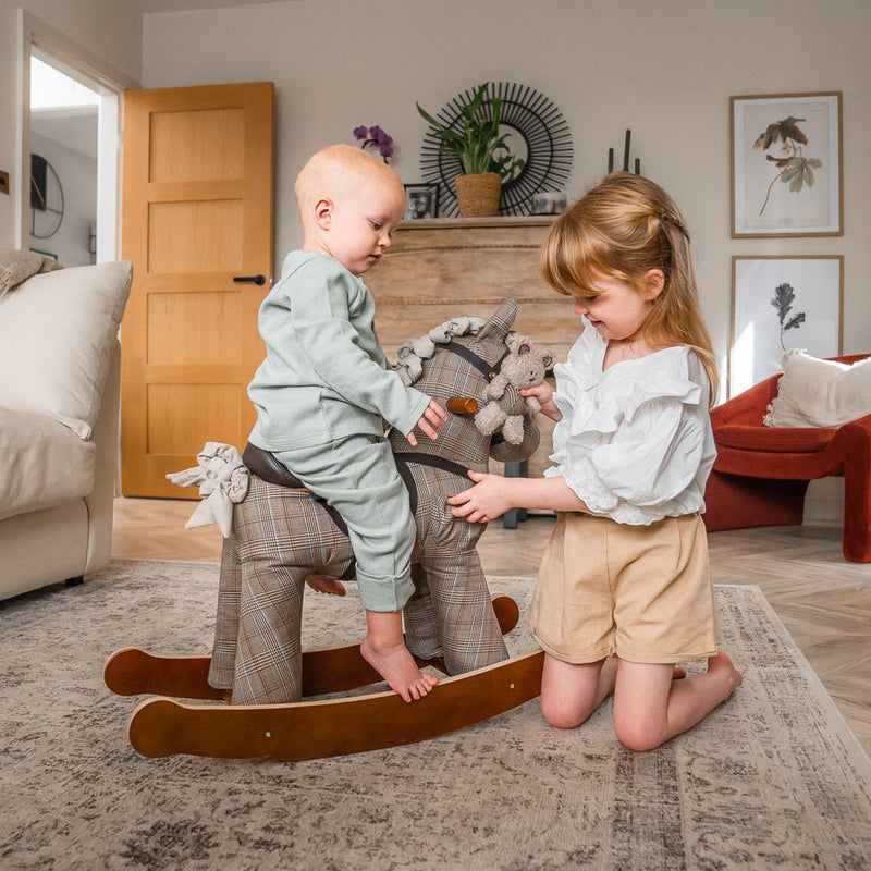 Sister playing her brother riding on the Little Bird Told Me Jasper & Blake Rocking Horse | Rocking Animals | Montessori Activities For Babies & Kids | Toys | Baby Shower, Birthday & Christmas - Clair de Lune UK