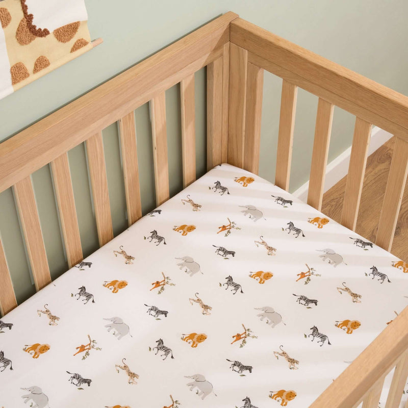 The animal print side of the 2 Pack Fitted Jungle Dream Cot Bed Sheets - 140 x 70 cm | Soft Baby Sheets | Cot, Cot Bed, Pram, Crib & Moses Basket Bedding - Clair de Lune UK
