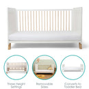 White Essentials Cot Bed showing the key features of removable sides, toddler bed and base height settings | Cots, Cot Beds & Toddler Beds | Nursery Furniture - Clair de Lune UK