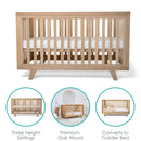 Solid Oak Cot Bed showing key features of mattress base heights, premium oak and conversion to toddler bed | Cots, Cot Beds, Toddler & Kid Beds | Baby Bed | Nursery Furniture - Clair de Lune UK