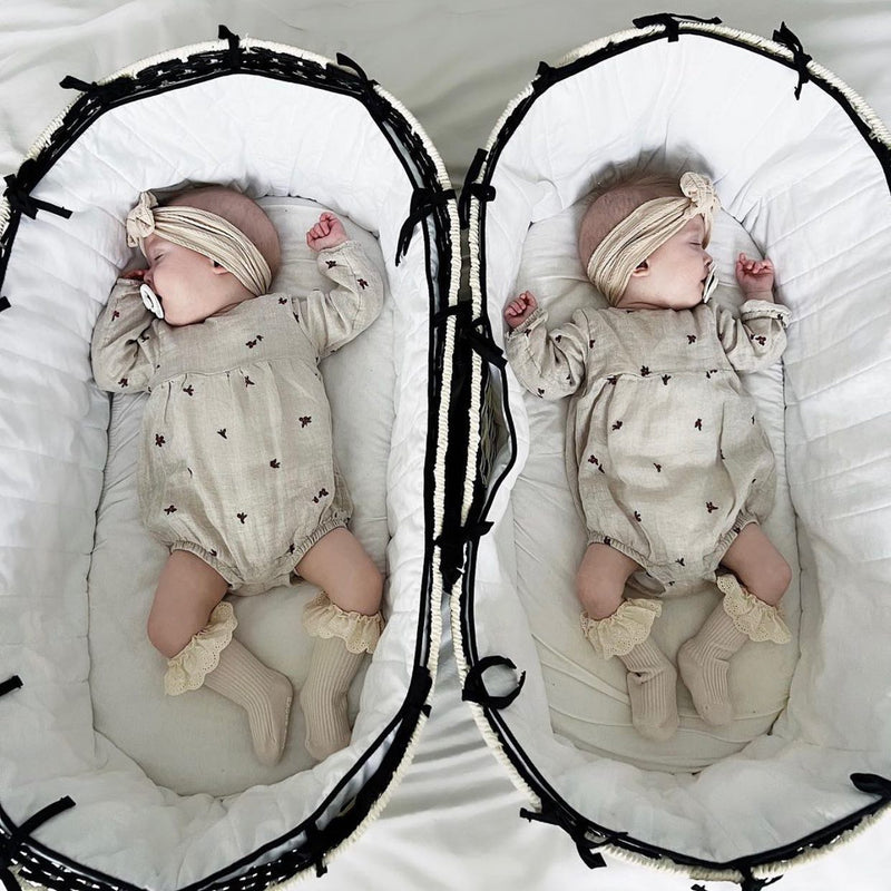 Twins sleeping in their Black & Cream Sustainable Moses Baskets | Moses Baskets and Stands | Co-sleepers | Nursery Furniture - Clair de Lune UK