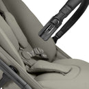 Close up for the removable bumper bar and 5 point safety harness on the Sage Green Hauck Fly N Care Pushchair on a white background | Prams and Strollers | Baby Travel Essentials - Clair de Lune UK