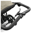 Close up on the brake and wrist-strap on the Olive Hauck Runner 3 Pushchair | Prams & Strollers | Baby Travel Essentials - Clair de Lune UK