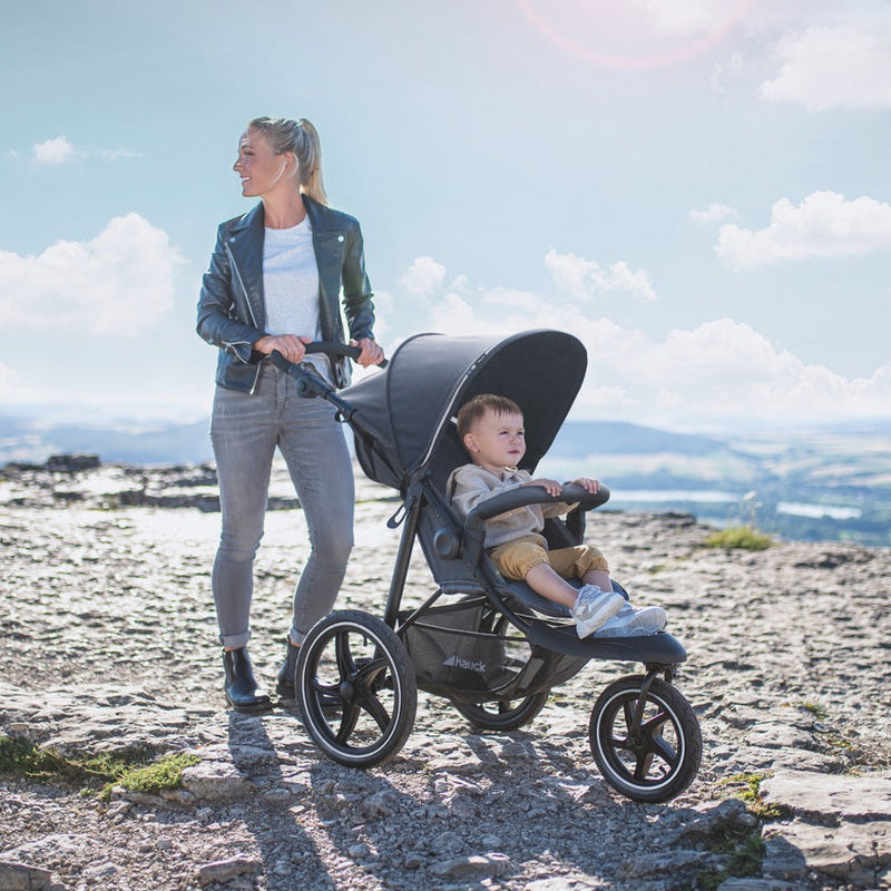 Mum pushing her Black Hauck Runner 2 Pushchair | Strollers | Pushchairs, Carrycots & Car Seats Baby | Travel Essentials - Clair de Lune UK