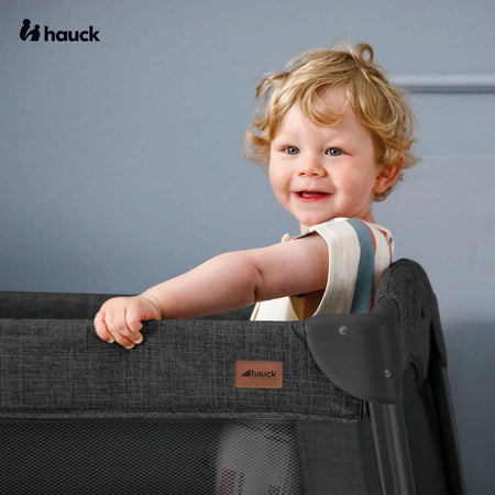Toddler is having fun in his Hauck Play N Relax Centre 4in1 Premium Travel Cot | Travel Cots & Travel Bassinets | Cots, Cot Beds, Toddler & Kid Beds | Nursery Furniture - Clair de Lune UK