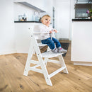 Toddler sat in the White Hauck Alpha+ Wooden Highchair adapts and changes depending on your childs life stage | Baby Highchairs, stools and seats - Clair de Lune UK