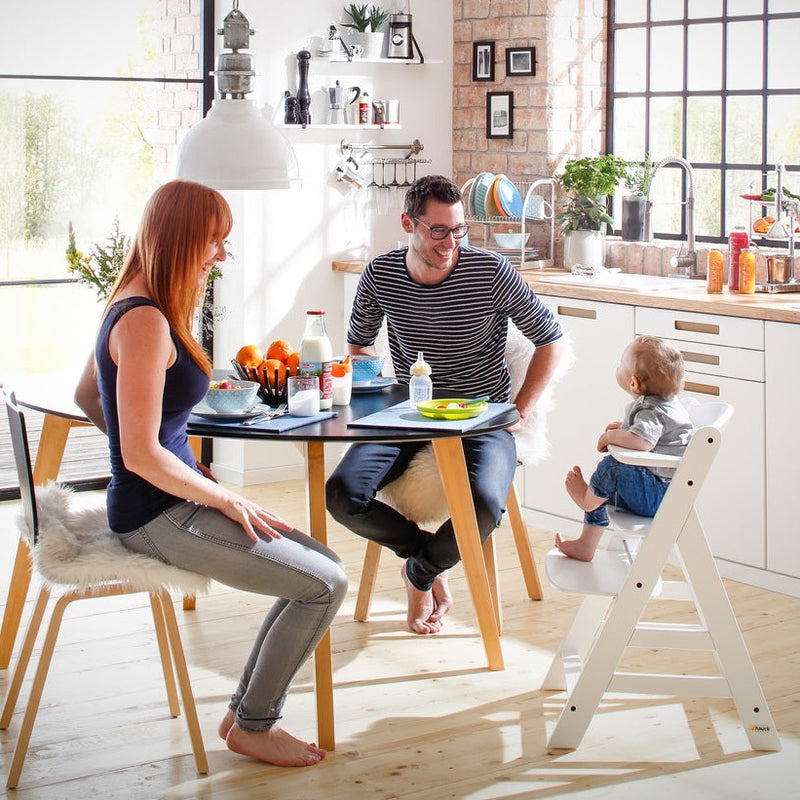 Mum and dad feeding toddler sitting on the Hauck Alpha+ Wooden Highchair with Removable Front Bar in White | Highchairs | Feeding & Weaning - Clair de Lune UK