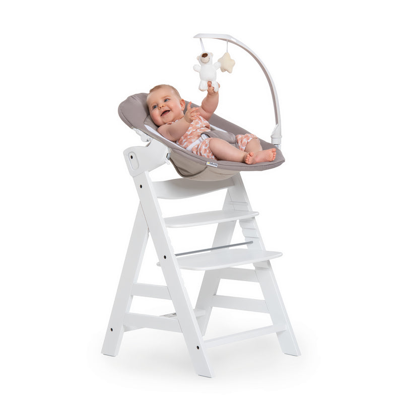 Baby playing on the Sand and White Hauck Alpha + Wooden High Chair & Deluxe Bouncer Bundle | Highchairs | Feeding & Weaning - Clair de Lune UK