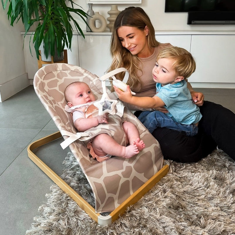 Dani Dyer and her baby on the My Babiie Dani Dyer Giraffe Baby Bouncer | Baby Swings, Rockers & Baby Bouncers | Toys - Clair de Lune