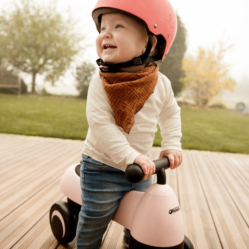 Toddler enjoys riding the pink Hauck 1st Ride Four Balance Bike | Toddler Bikes | Montessori Activities For Babies & Kids - Clair de Lune UK