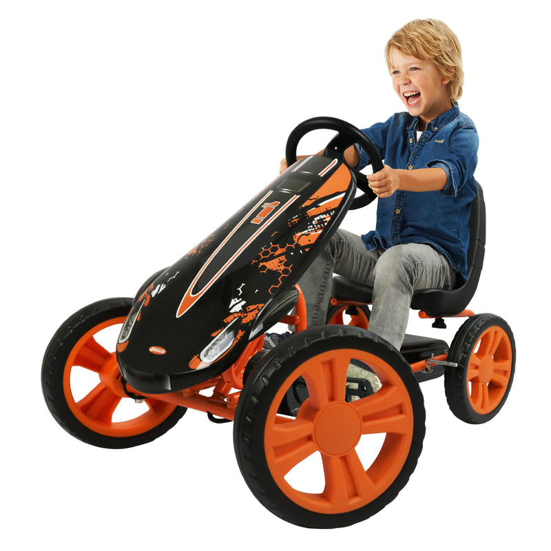 Boy riding the Orange Hauck Speedster Go Kart | Wagons & Go Karts | Baby & Kid Travel - Clair de Lune UK