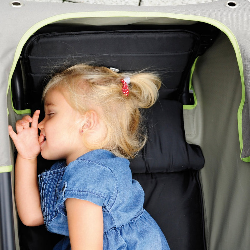 Baby girl napping in the Hauck Eco Mobil Wagon | Wagons & Go Karts | Baby & Kid Travel - Clair de Lune UK