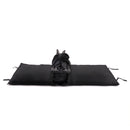 Black East Coast Travel Cot folded and resting on top of the baby mattress | Cribs & Travel Cots | Nursery Furniture - Clair de Lune UK