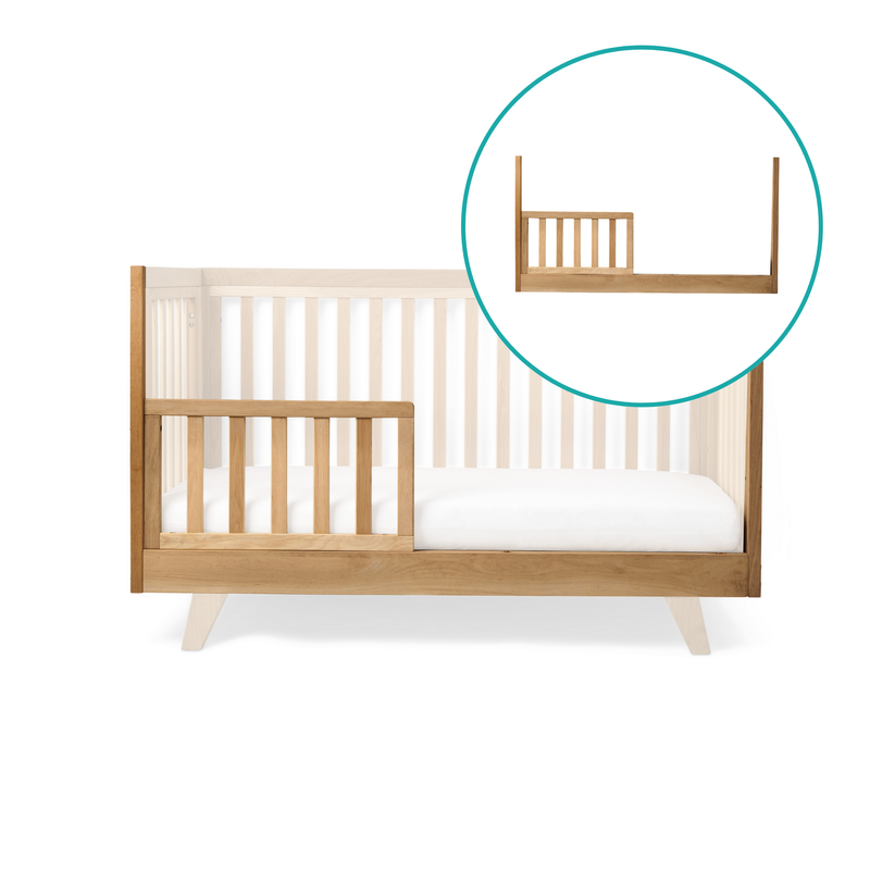 Close up of Oak Cot Bed Extension Kit converted to a toddler bed in neutral nursery | Cots, Cot Beds, Toddler & Kid Beds | Nursery Furniture - Clair de Lune UK