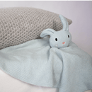 Organic knitted GrowGrows Bunny Animal Comforter propped on a cushion - Clair de Lune UK