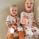 Brothers smiling together wearing the Grow Grows Organic Fluffy Foxes Sleepsuit | Baby Grows and Onesies | Organic Baby Clothes - Clair de Lune UK