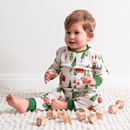 Toddler sat playing with wooden bricks wearing the GrowGrows Organic Alpine Adventures Pyjamas | Organic Kids PJs and Nightwear - Clair de Lune UK