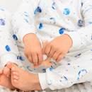 Close up on child wearing the Grow Grows Organic Marvellous Moons Pyjamas | Organic Kids PJs and Nightwear - Clair de Lune UK