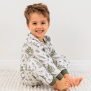 Baby Boy sat on the floor wearing the Grow Grows Organic Country Leaf Pyjamas | Organic Kids PJs and Nightwear - Clair de Lune UK