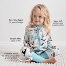 Toddler sat on the floor wearing the Grow Grows Organic Arctic Animals Sleepsuit in a white room with key features | Baby Grows and Onesies | Organic Baby Clothing - Clair de Lune UK