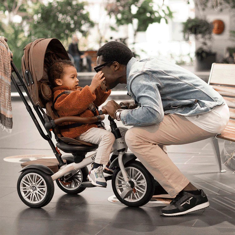 Dad and son playing with each other while the son is sitting on the Brown Bentley 6in1 Trike - Convertible Baby Stroller | Strollers, Pushchairs & Prams | Pushchairs, Carrycots & Car Seats Baby | Travel Essentials - Clair de Lune UK