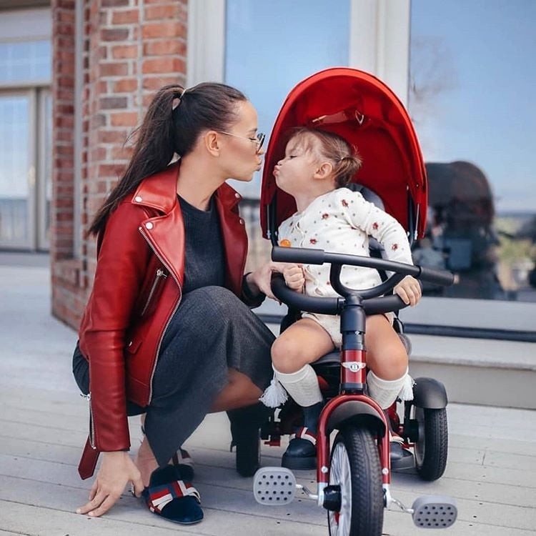 Mum talking to baby girl sitting on the Dragon Red Bentley 6in1 Trike - Convertible Baby Stroller | Strollers, Pushchairs & Prams | Pushchairs, Carrycots & Car Seats Baby | Travel Essentials - Clair de Lune UK
