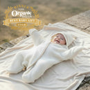  Baby wearing the Cream Sunny Day Organic Star Breathable Wrap in a summer garden Gold Winner of Best Baby Gift at the Organic & Sustainable Baby Awards | Cosy Baby Blankets and Swaddles | Newborn Summer Essentials - Clair de Lune UK