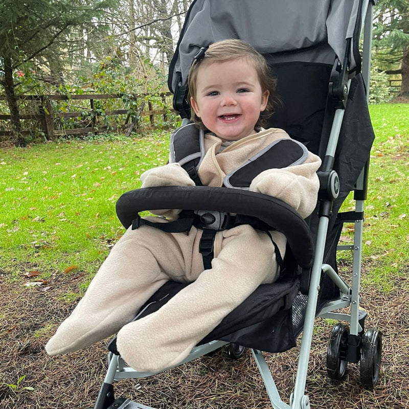 Toddler girl wearing the Beige Star Fleece Baby Wrap Blanket | Cosy Baby Blankets | Nursery Bedding | Newborn, Baby and Toddler Essentials - Clair de Lune UK