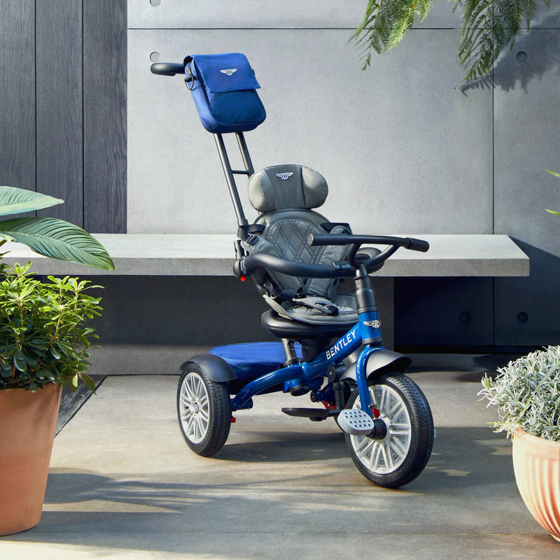 The side of the Sequin Blue Bentley 6in1 Trike - Convertible Baby Stroller in a garden | Strollers, Pushchairs & Prams | Pushchairs, Carrycots & Car Seats Baby | Travel Essentials - Clair de Lune UK