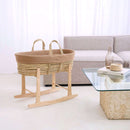 Biscuit Brown Organic Knitted Palm Moses Basket on natural rocking stand in a white ultra stylish minimalist living room next to an organic cork and glass coffee table | Moses Baby Baskets, Bassinets | Organic Baby Essentials | Nursery Furniture - Clair de Lune UK